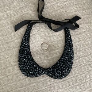 Crystal glow grain ribbon necklace. .